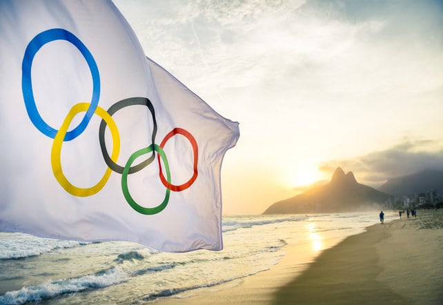 Olympic flag on beach