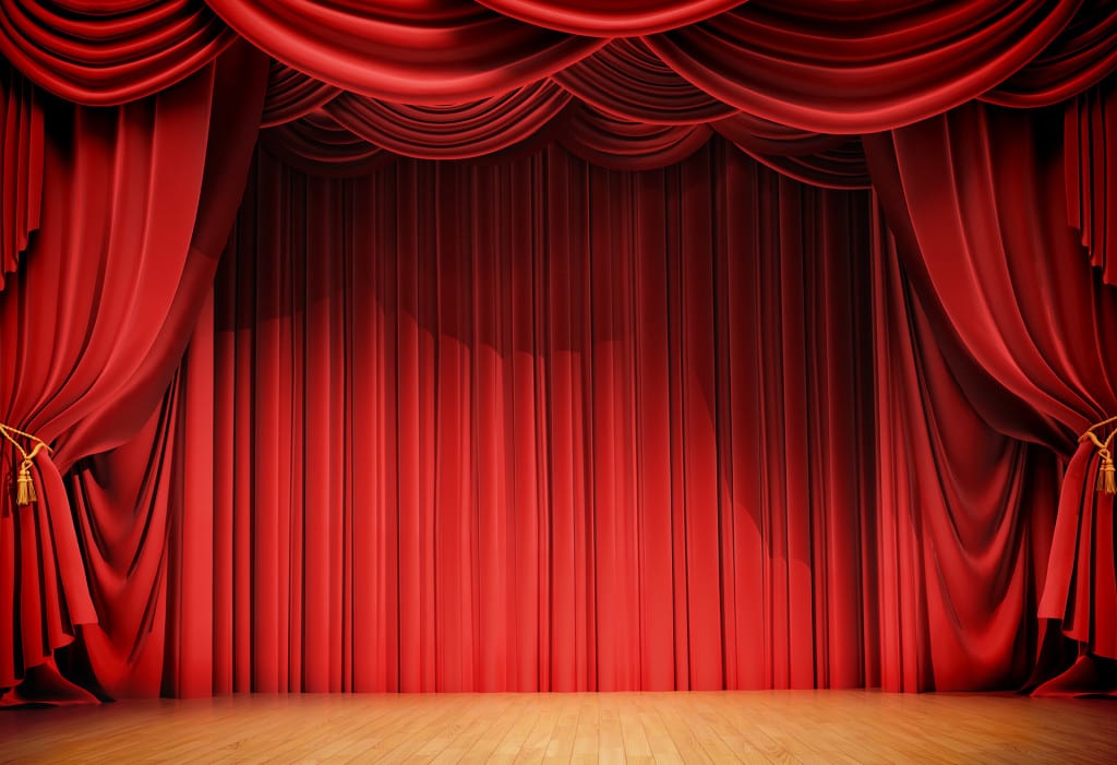 velvet curtains and wooden stage floor