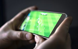 watching soccer match live stream on hand held device
